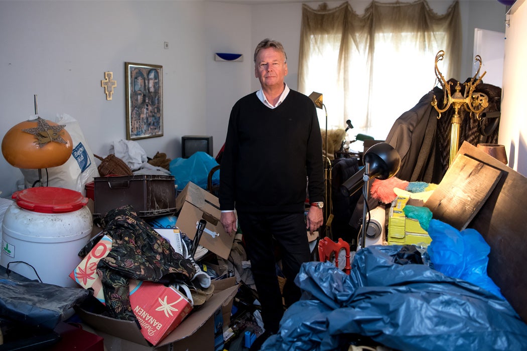 Someone standing in the room of a hoarder