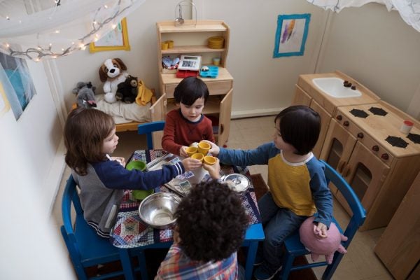 A toddler tea party in a play house