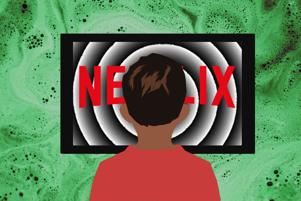 A child in front of an ominous Netflix television screen.