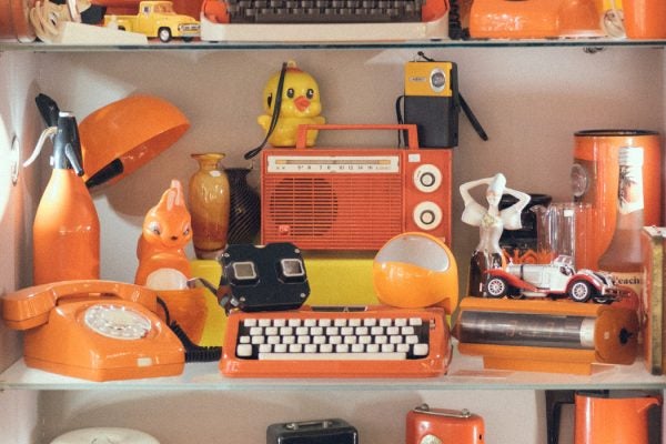 A variety of vintage orange plastic items