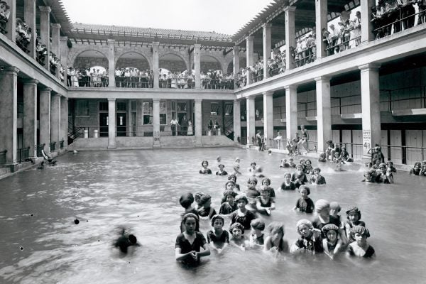 Girls in a swimming class entertain an audience of neighborhood residents at Mullanphy Pool in St. Louis, MO