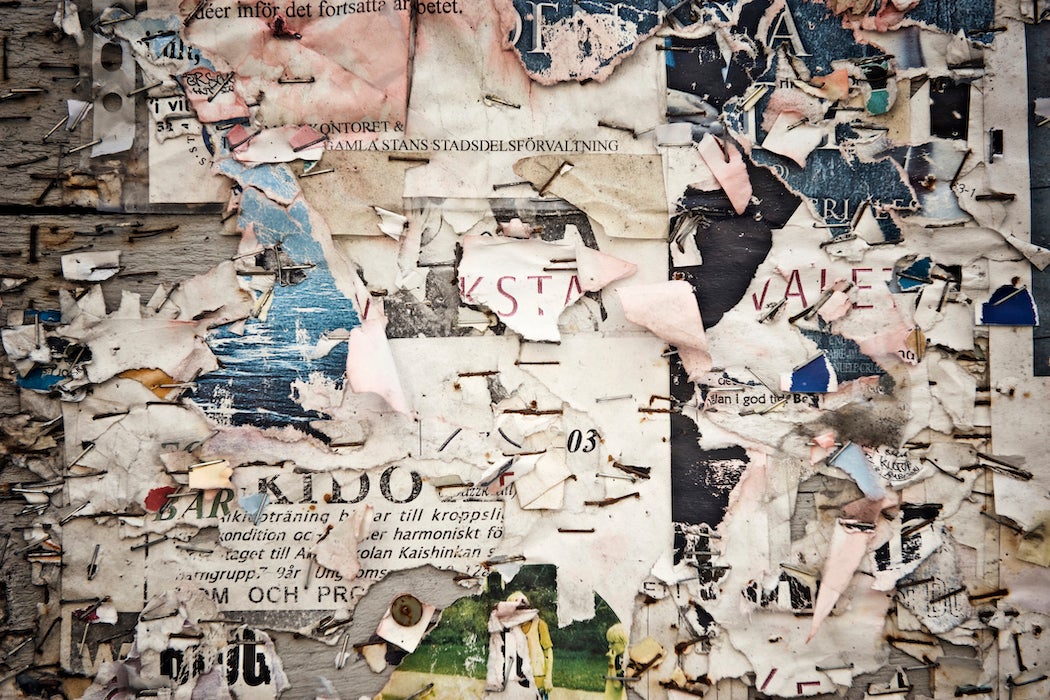View of torn poster on wall