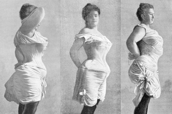 Three women wearing corsets
