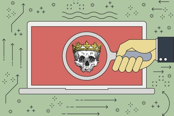 A laptop with a skull wearing a crown on its screen