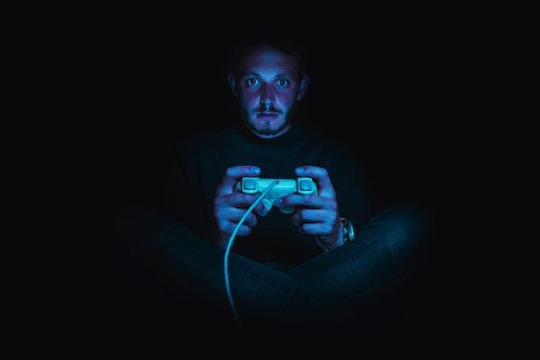 A gamer playing in the dark