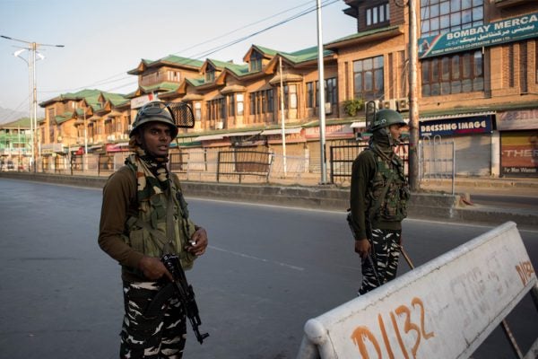 Indian Paramilitary troopers stand guard in the city center Srinagar, Kashmir, India