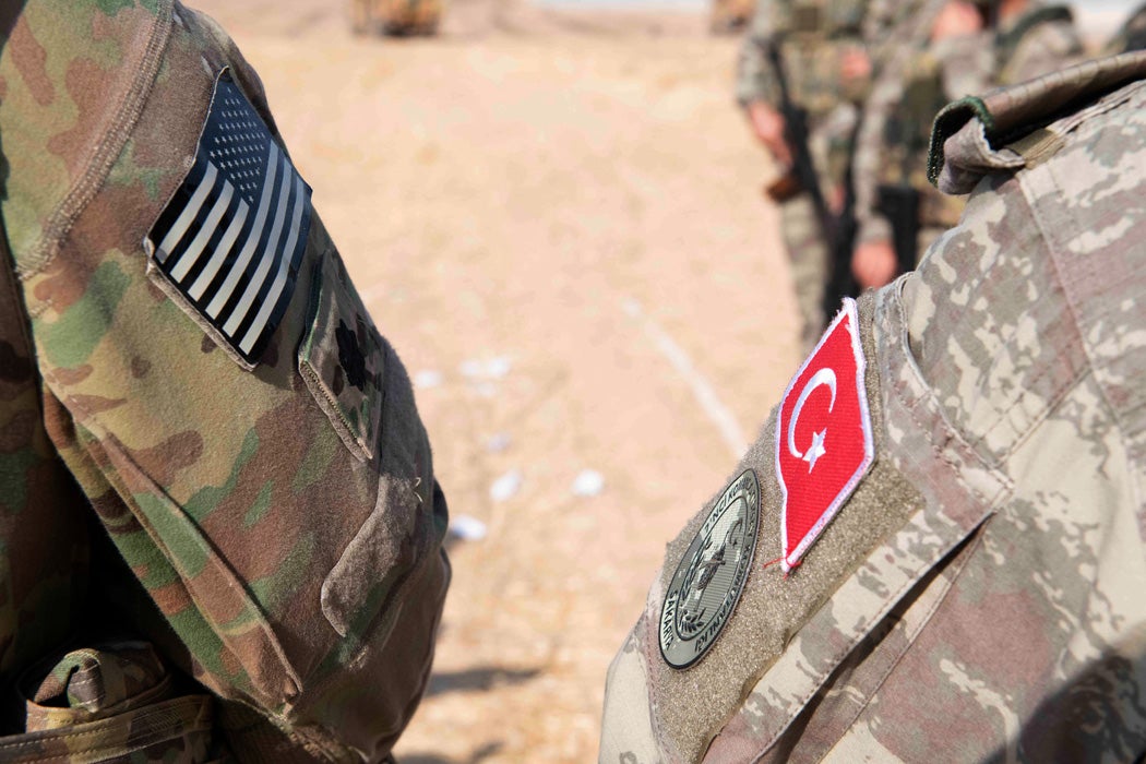 An American and Turkish soldier in Syria