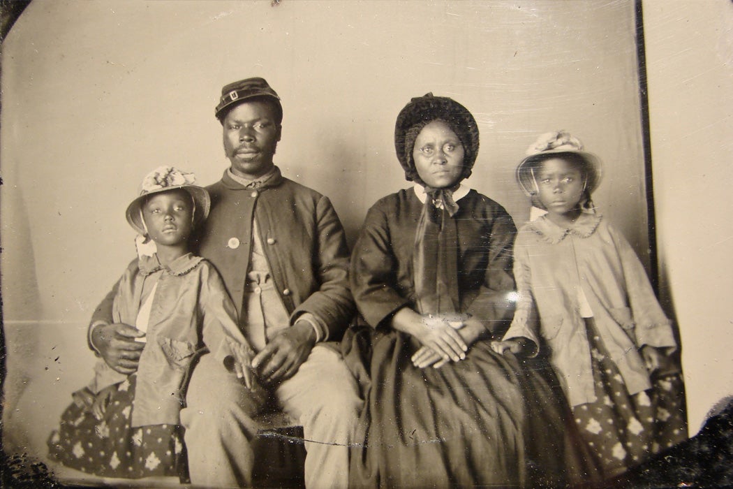 Unidentified African American soldier in Union uniform with wife and two daughters