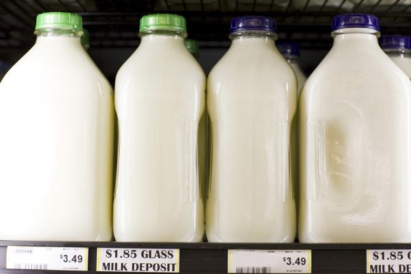 Milk in glass jugs at a supermarket