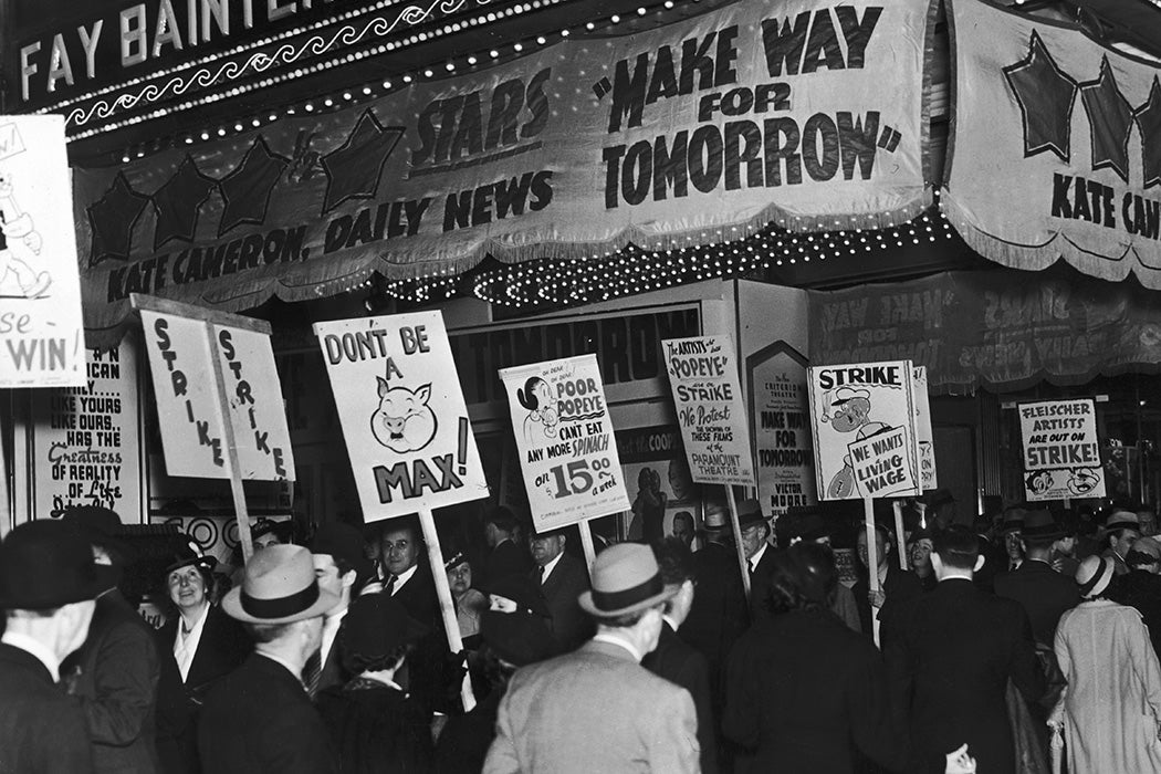 Employees of the Fleischer Studios picket the New Criterion Theater in New York to protest against the showing of Popeye and other cartoons drawn by striking Fleischer artists, 1937.