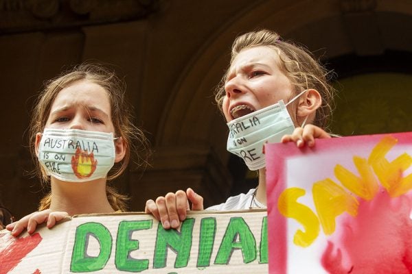 Young girls chant as activists rally for climate action at Sydney Town Hall on January 10, 2020 in Sydney, Australia.