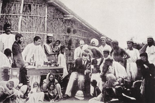 Photograph showing Waldemar Mordecai Wolffe Haffkine (1860-1930), Bacteriologist with the Government of India, inoculating a community against cholera in Calcutta, March 1894.