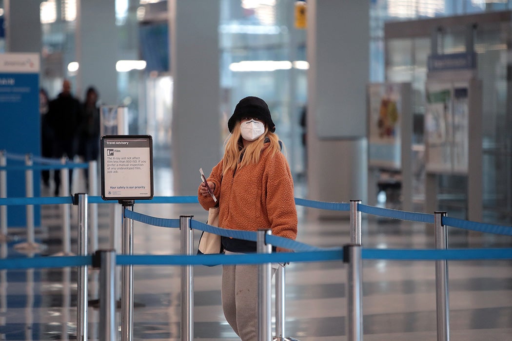 A passenger goes through TSA screening