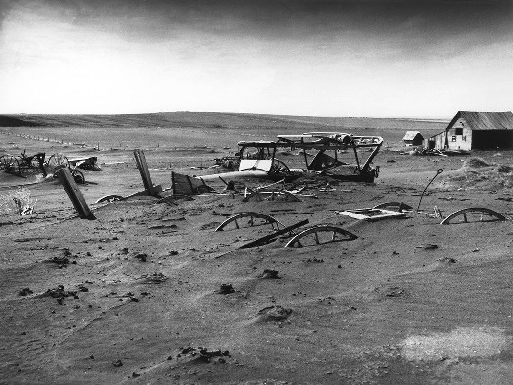 Buried machinery in barn lot in Dallas, South Dakota, United States during the Dust Bowl, 1936