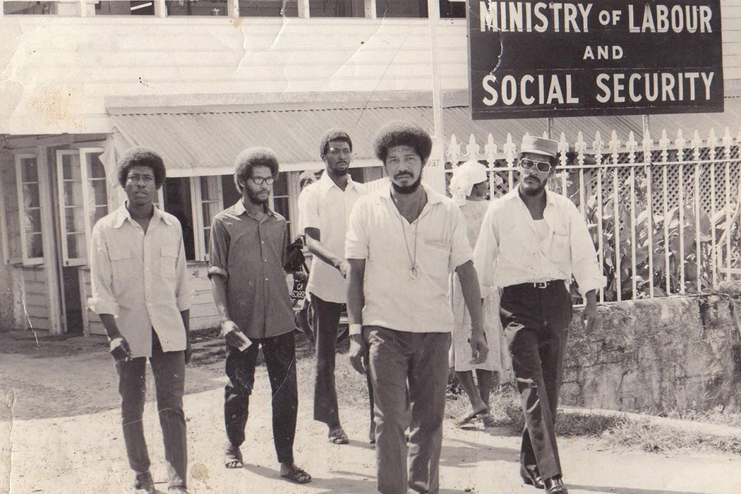 Walter Rodney and W.P.A members exit the Ministry of Labour & Social Security, Guyana - 1970s