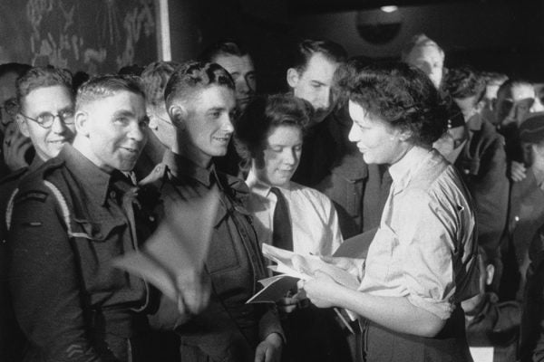 UK research organisation Mass-Observation conducts a survey at the Nuffield Centre, a Service Club in Soho, to find out the preferred 'pin-up girl' of a number of servicemen, September 1944.