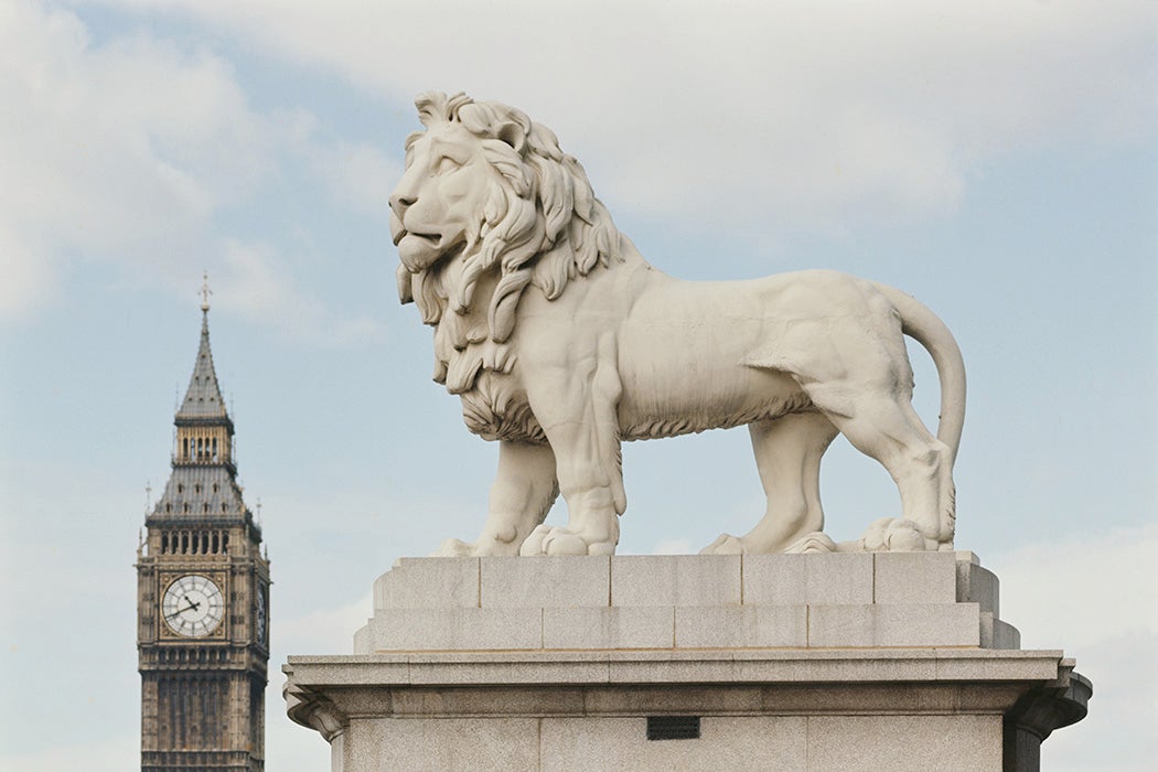 Statue of The South Bank Lion in London with Big Ben in the background