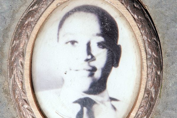 A photo of Emmett Till is included on the plaque that marks his gravesite at Burr Oak Cemetery in Aslip, Illinois.