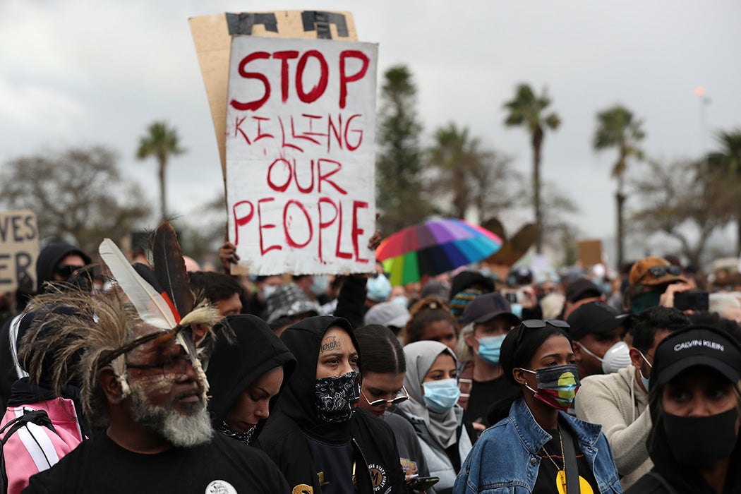 Protesters show their support during the Black Lives Matter Rally at Langley Park on June 13, 2020 in Perth, Australia.