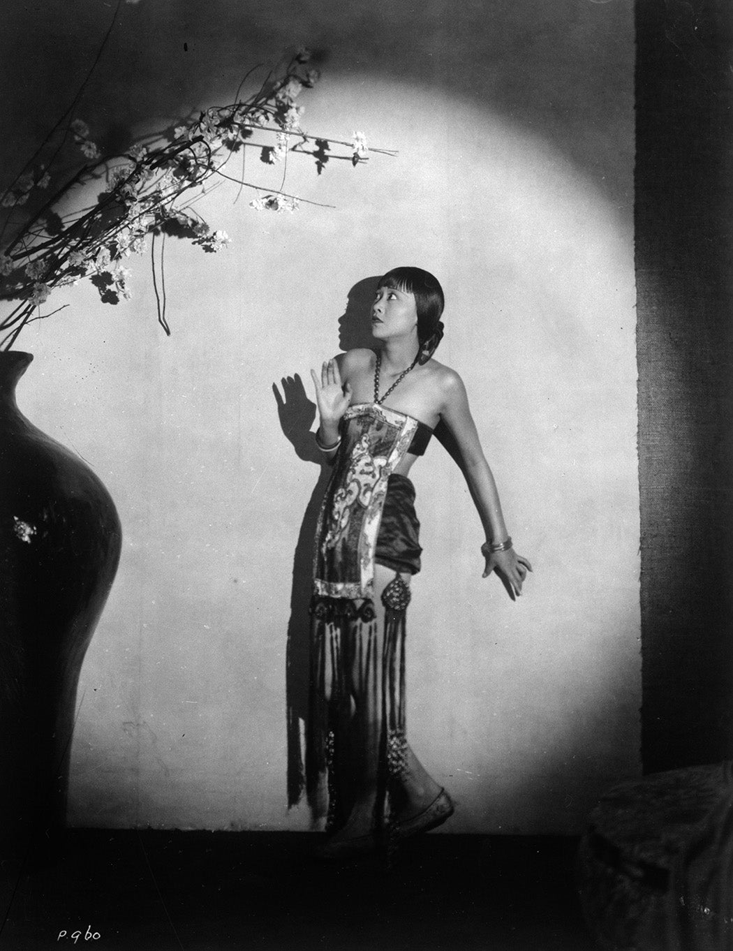 Anna May Wong surrounded by ominous shadows, c. 1930