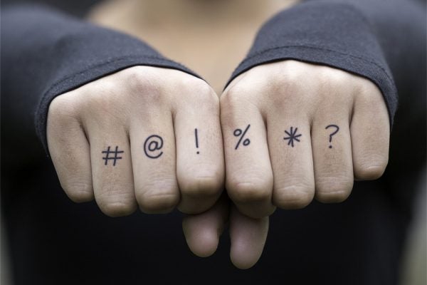 Tattoos on a person's knuckles