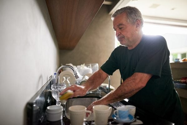 A man doing the dishes at home