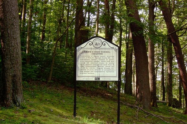 A historical marker for the Hawks Nest Tunnel disaster