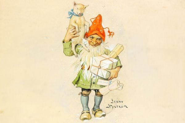 An elf carrying gifts