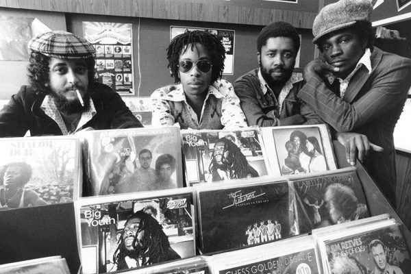 From left, Desmond Bryan, Caesar Andrews, Delroy Witter and Ken Murray, in the 'Into Reggae' record shop, 3rd October 1975.