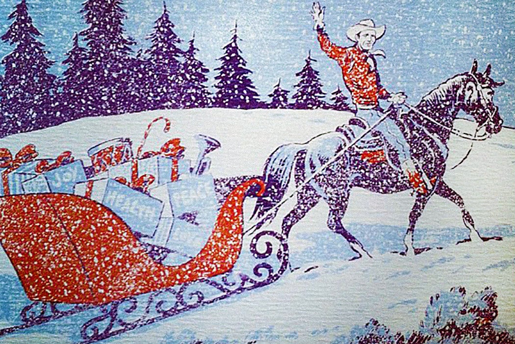 A cowboy pulling a sleigh of gifts