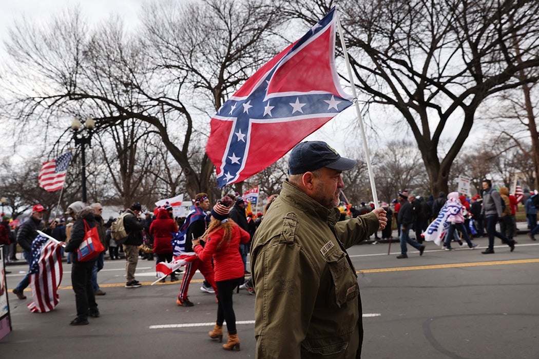 A man holding a confederate flag at the "Stop the Steal" rally on January 06, 2021 in Washington, DC.