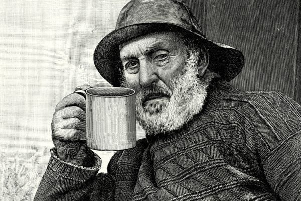 Vintage engraving of an old fisherman drinking a cup of tea, 1900