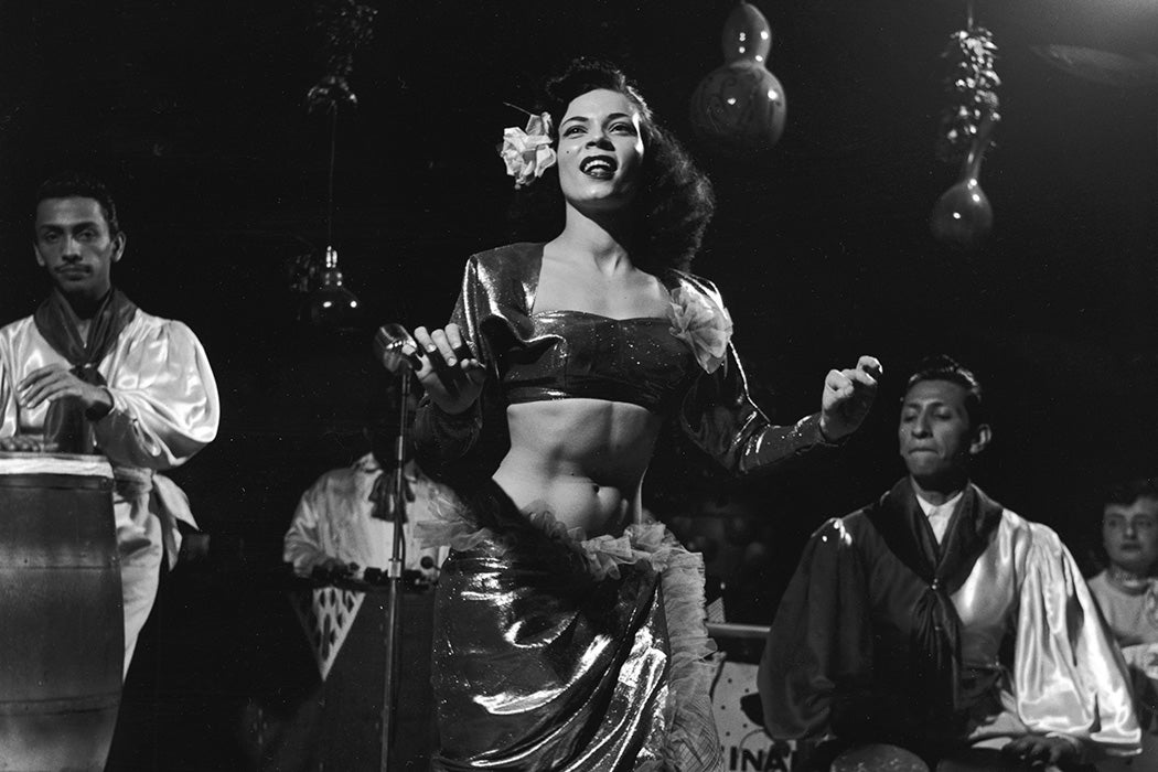 Mango the Mambo dancer performs on stage with drum accompaniment, 1954