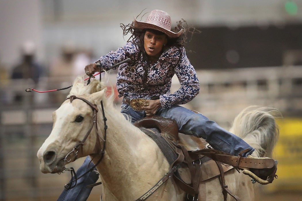 A cowgirl participates in the barrel race competition at the Bill Pickett Invitational Rodeo on April 1, 2017 in Memphis, Tennessee.