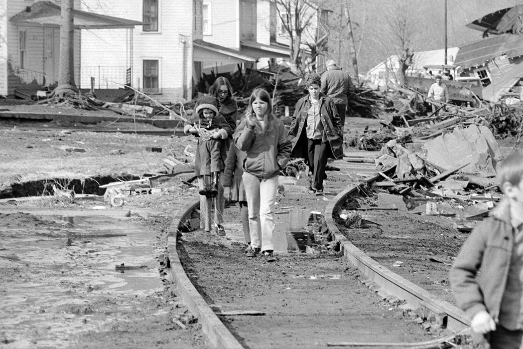 Children walk along the tracks in what remains of their community along Buffalo Creek on Feb. 27, 1972.