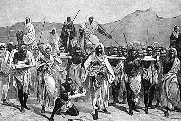 A 19th-century engraving depicting an Arab slave-trading caravan transporting black African slaves across the Sahara.
