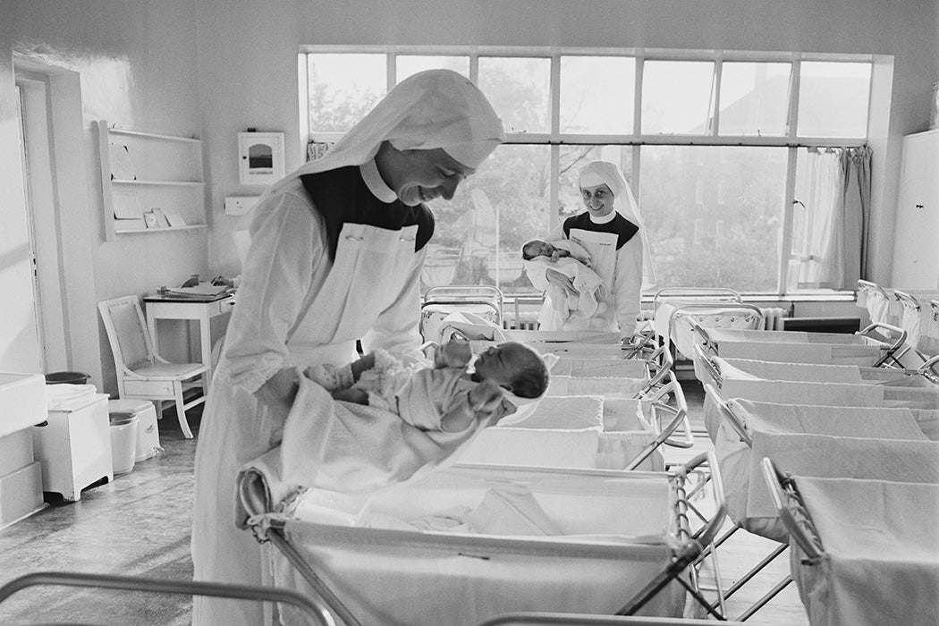 Two nuns caring for newborn babies, 1967