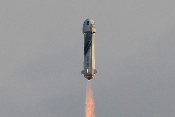 The New Shepard Blue Origin rocket lifts-off from the launch pad carrying Jeff Bezos along with his brother Mark Bezos, 18-year-old Oliver Daemen, and 82-year-old Wally Funk