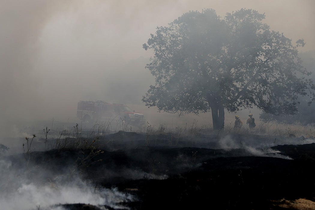Firefighters monitor a controlled burn at Bouverie Preserve on May 30, 2017 in Glen Ellen, California