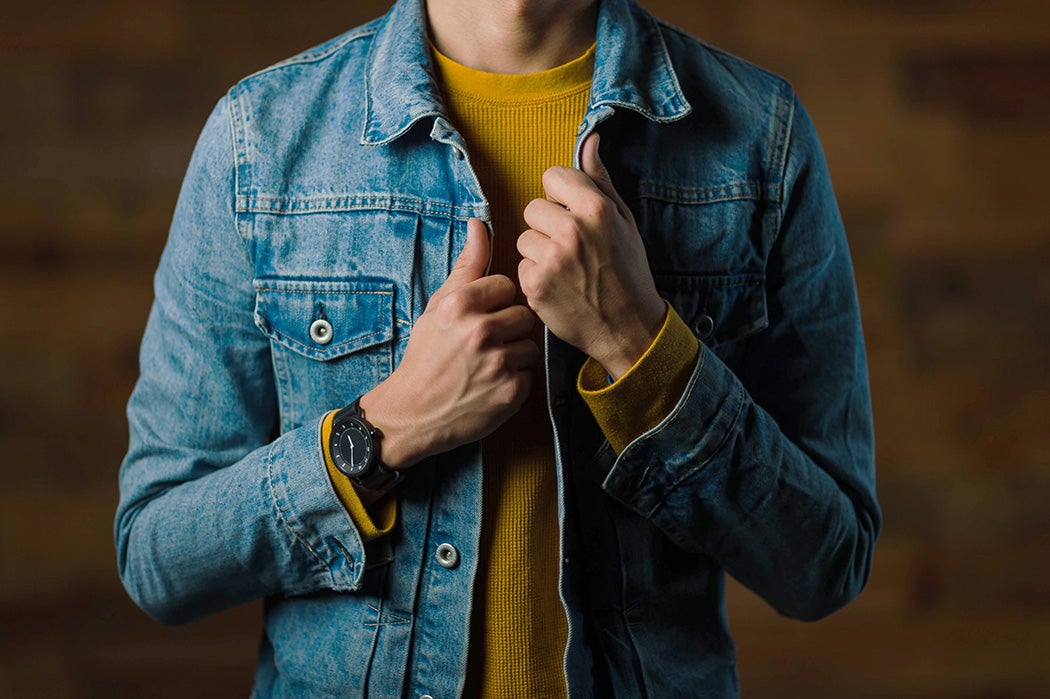 A person wearing a denim jacket