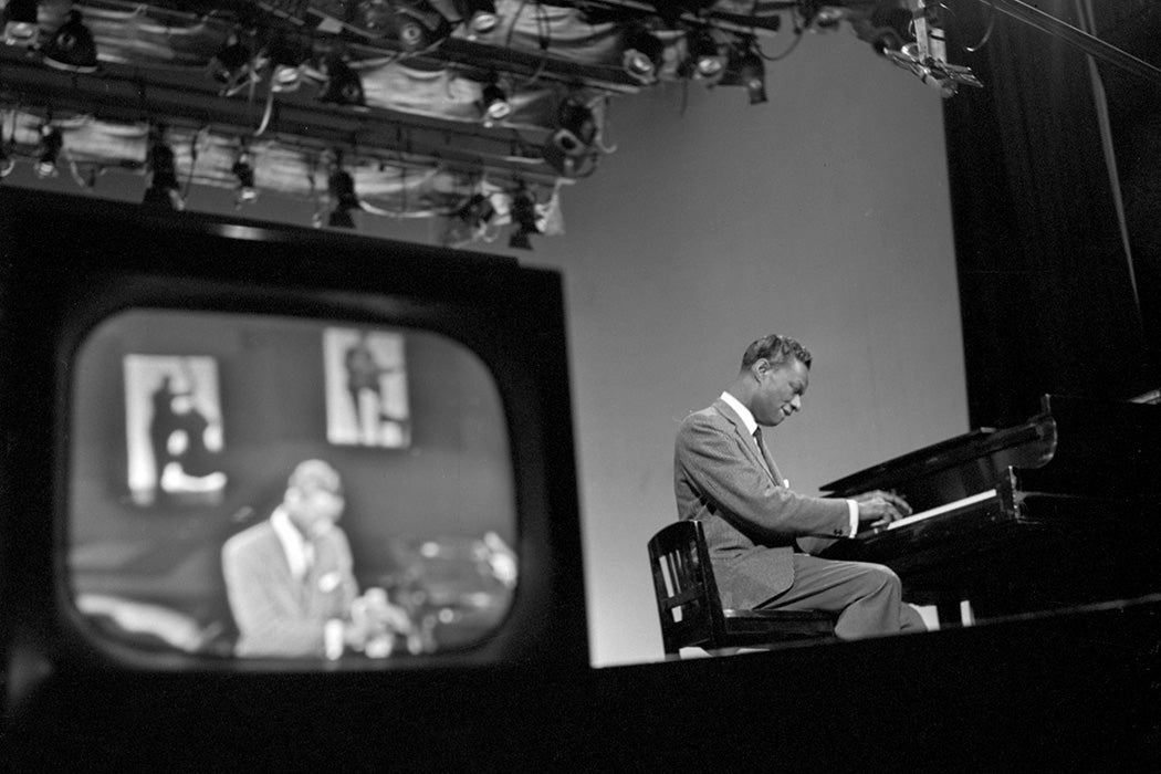 Nat "King" Cole performs a song on piano on "The Ed Sullivan Show" on April 13, 1958 in New York City