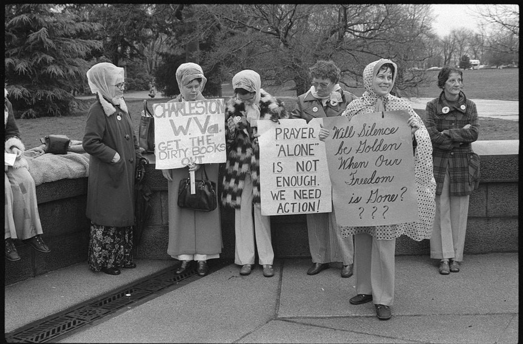 Women from Boston and Charleston, West Virginia, holding signs, demonstrating against textbooks, Washington, D.C., 1975