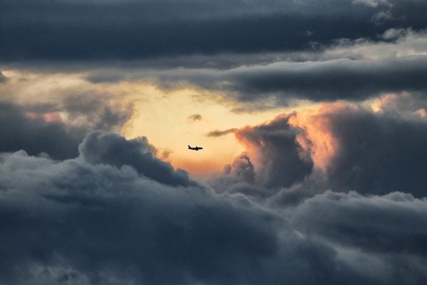 View of an airliner throughout stormy clouds and just inside a calm weather.