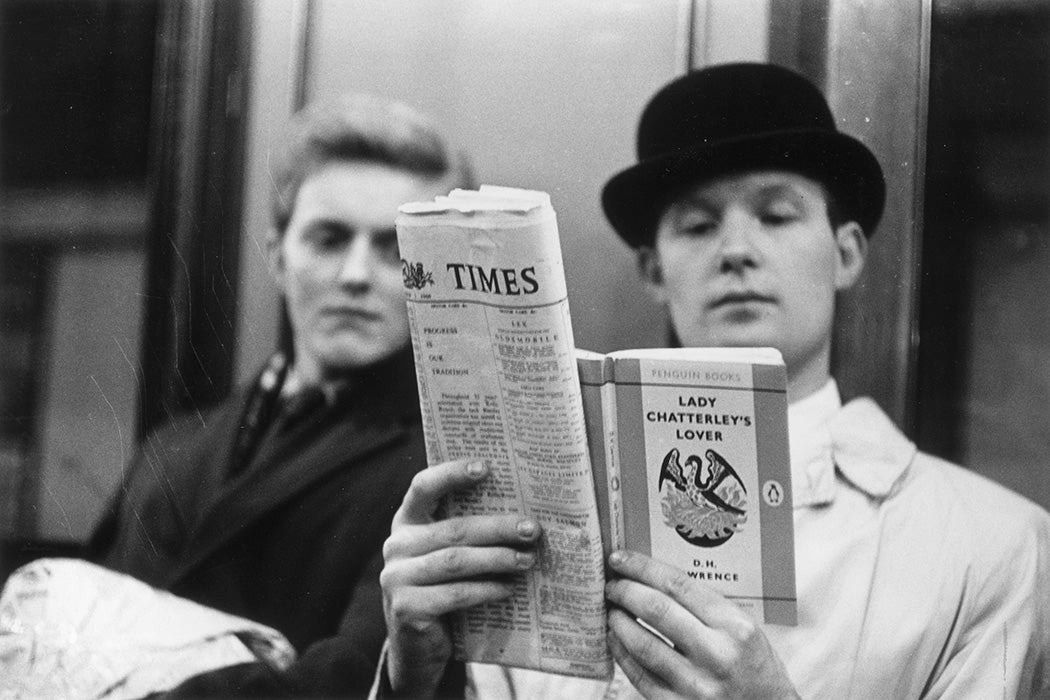 a passenger on the London Underground, reading D H Lawrence's 'Lady Chatterley's Lover'
