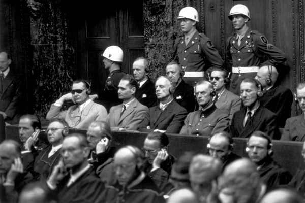 Some of the chief defendants listening to the court summary at the Nuremberg War Trials. In the front row (from left to right) are Goering, Hess, von Ribbentrop, Keitel, Kaltenbrunner and Rosenberg. In the back row are Doenitz, Raeder, von Schirach and Sauckel.