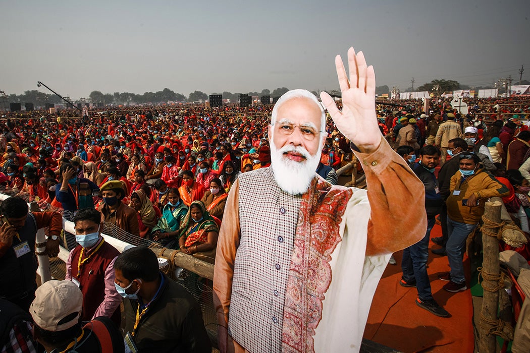 Women from various districts are seen near cut-outs of India's Prime Minister Narendra Modi at a rally held by Modi on December 21, 2021 in Allahabad, India.