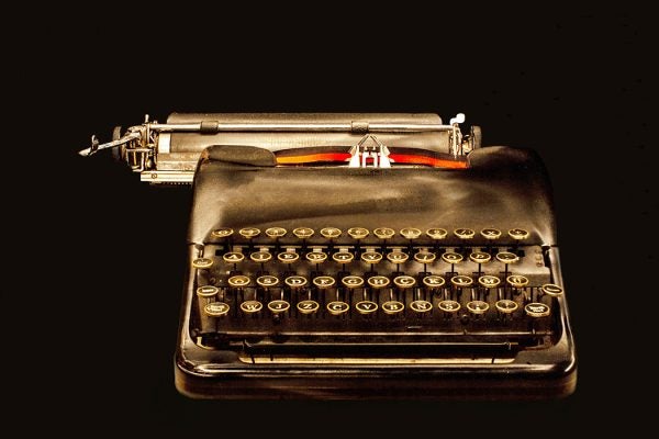 A typewriter on a black background