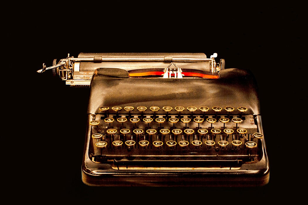 A typewriter on a black background