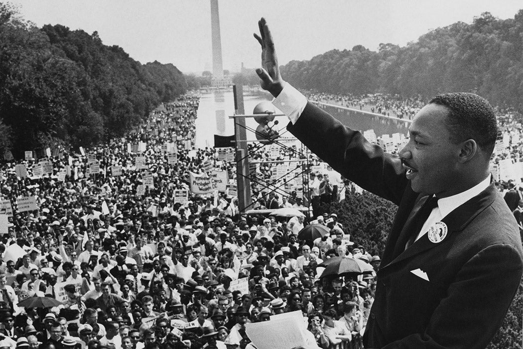Dr Martin Luther King Jr (1929 - 1968) waves to the crowd of more than 200,000 people gathered on the Mall after delivering his 'I Have a Dream' speech at the March on Washington for Jobs and Freedom, Washington DC, 28th August 1963.