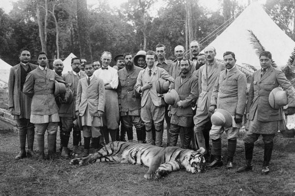 The Prince of Wales posing with a tiger he shot on his tour of Nepal, India, on December 18, 1921